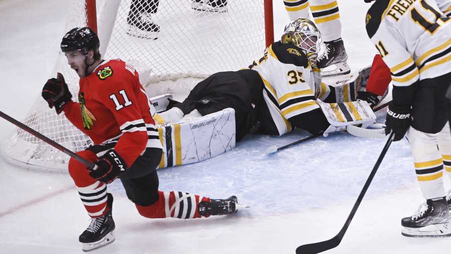 Chicago Blackhawks right wing Taylor Raddysh (11) celebrates after his goal against Boston Bruins goaltender Linus Ullmark (35) during the third period of an NHL hockey game Tuesday, March 14, 2023, in Chicago. (AP Photo/Matt Marton)