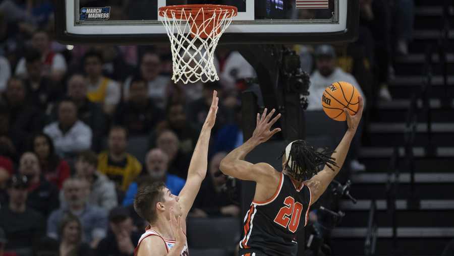Princeton forward Tosan Evbuomwan (20) scores a basket in front of Arizona forward Azuolas Tubelis (10) during the first half of a first-round college basketball game in the NCAA Tournament in Sacramento, Calif., Thursday, March 16, 2023. (AP Photo/José Luis Villegas)