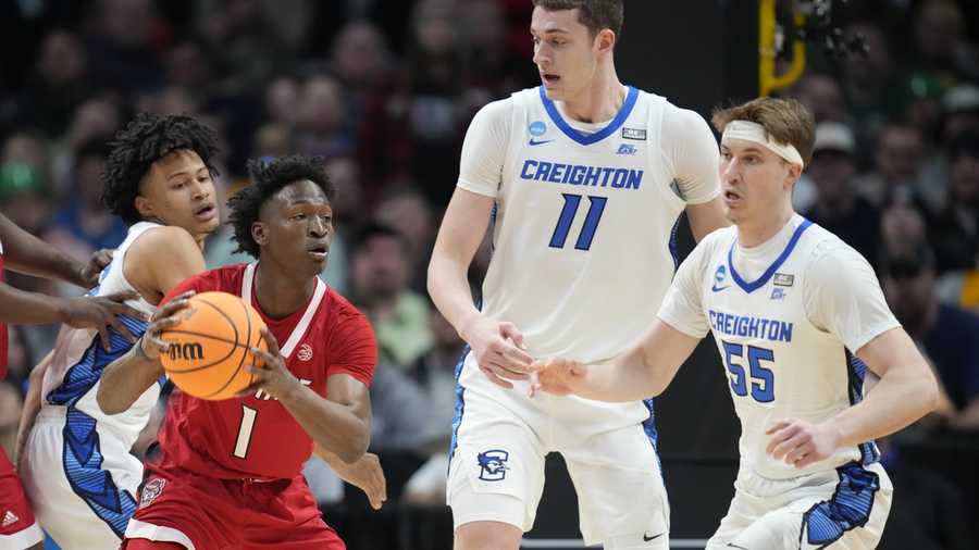 March Madness North Carolina State guard Jarkel Joiner, front left, looks to pass the ball as, from left rear, Creighton guard Trey Alexander, center Ryan Kalkbrenner and guard Francisco Farabello defend in the first half of a first-round college basketball game in the men's NCAA Tournament Friday, March 17, 2023, in Denver. (AP Photo/John Leyba)