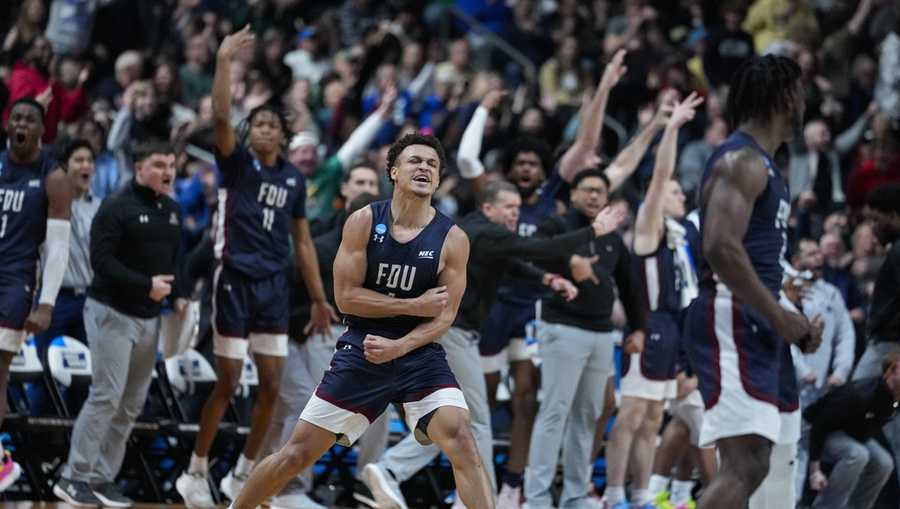 Fairleigh Dickinson guard Grant Singleton (4) celebrates after a basket against Purdue in the second half of a first-round college basketball game in the men&apos;s NCAA Tournament in Columbus, Ohio, Friday, March 17, 2023. (AP Photo/Michael Conroy)