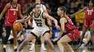 Iowa guard Caitlin Clark (22) drives around Georgia guard Alisha Lewis (23) in the first half of a second-round college basketball game in the NCAA Tournament, Sunday, March 19, 2023, in Iowa City, Iowa. (AP Photo/Charlie Neibergall)