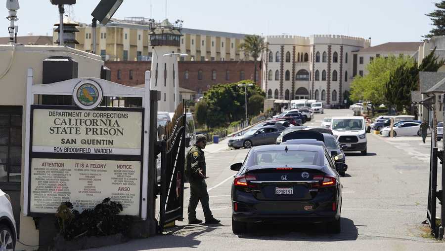 FILE - A guard checks vehicles entering the main gate at San Quentin State Prison on April 12, 2022, in San Quentin, Calif. California Gov. Gavin Newsom plans to transform a state prison home to the nation&apos;s largest number of inmates on death row into a facility where prisoners can receive education, training and rehabilitation before reentering society. Newsom&apos;s office announced the new plans for San Quentin State Prison on Thursday, March 16, 2023. (AP Photo/Eric Risberg, File)
