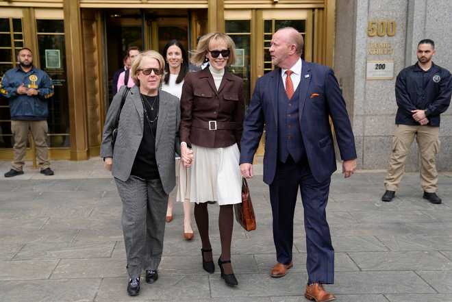 MAY&#x20;9,&#x20;2023&#x20;-&#x20;E.&#x20;Jean&#x20;Carroll,&#x20;center,&#x20;walks&#x20;out&#x20;of&#x20;Manhattan&#x20;federal&#x20;court,&#x20;Tuesday,&#x20;May&#x20;9,&#x20;2023,&#x20;in&#x20;New&#x20;York.&#x20;A&#x20;jury&#x20;has&#x20;found&#x20;Donald&#x20;Trump&#x20;liable&#x20;for&#x20;sexually&#x20;abusing&#x20;the&#x20;advice&#x20;columnist&#x20;in&#x20;1996,&#x20;awarding&#x20;her&#x20;&#x24;5&#x20;million&#x20;in&#x20;a&#x20;judgment&#x20;that&#x20;could&#x20;haunt&#x20;the&#x20;former&#x20;president&#x20;as&#x20;he&#x20;campaigns&#x20;to&#x20;regain&#x20;the&#x20;White&#x20;House.&#x20;&#x28;AP&#x20;Photo&#x2F;John&#x20;Minchillo&#x29;
