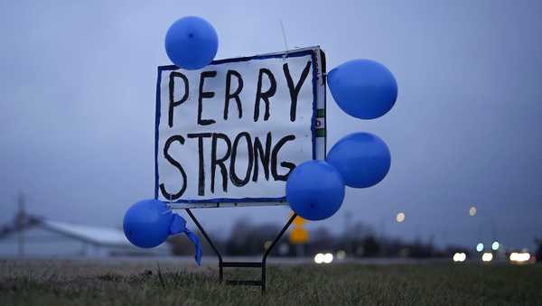 A sign along Highway 141 in Granger, Iowa, shows support for the neighboring community of Perry on Friday, Jan. 5, 2024, following a shooting at the Perry Middle School and High School building the previous day. (AP Photo/Bryon Houlgrave)