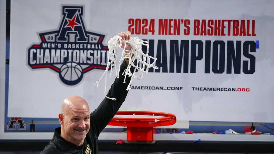 UAB head coach Andy Kennedy holds the net after cutting it while celebrating his team&apos;s NCAA college basketball win in the championship of the American Athletic Conference tournament against Temple, Sunday, March 17, 2024, in Fort Worth, Texas. UAB won 85-69. (AP Photo/Julio Cortez)
