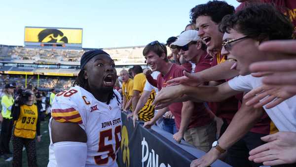 Iowa State defensive lineman J.R. Singleton (58) celebrates with fans after an NCAA college football game against Iowa, Saturday, Sept. 7, 2024, in Iowa City, Iowa. Iowa State won 20-19. (AP Photo/Charlie Neibergall)