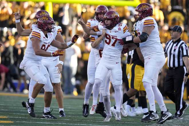 Iowa&#x20;State&#x20;place&#x20;kicker&#x20;Kyle&#x20;Konrardy&#x20;&#x28;97&#x29;&#x20;celebrates&#x20;with&#x20;teammates&#x20;after&#x20;kicking&#x20;a&#x20;54-yard&#x20;field&#x20;goal&#x20;during&#x20;the&#x20;second&#x20;half&#x20;of&#x20;an&#x20;NCAA&#x20;college&#x20;football&#x20;game&#x20;against&#x20;Iowa,&#x20;Saturday,&#x20;Sept.&#x20;7,&#x20;2024,&#x20;in&#x20;Iowa&#x20;City,&#x20;Iowa.&#x20;Iowa&#x20;State&#x20;won&#x20;20-19.&#x20;&#x28;AP&#x20;Photo&#x2F;Charlie&#x20;Neibergall&#x29;