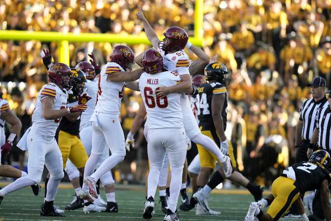 Iowa&#x20;State&#x20;place&#x20;kicker&#x20;Kyle&#x20;Konrardy&#x20;&#x28;97&#x29;&#x20;celebrates&#x20;with&#x20;teammate&#x20;Tyler&#x20;Miller&#x20;&#x28;66&#x29;&#x20;after&#x20;kicking&#x20;a&#x20;54-yard&#x20;field&#x20;goal&#x20;during&#x20;the&#x20;second&#x20;half&#x20;of&#x20;an&#x20;NCAA&#x20;college&#x20;football&#x20;game&#x20;against&#x20;Iowa,&#x20;Saturday,&#x20;Sept.&#x20;7,&#x20;2024,&#x20;in&#x20;Iowa&#x20;City,&#x20;Iowa.&#x20;Iowa&#x20;State&#x20;won&#x20;20-19.&#x20;&#x28;AP&#x20;Photo&#x2F;Charlie&#x20;Neibergall&#x29;