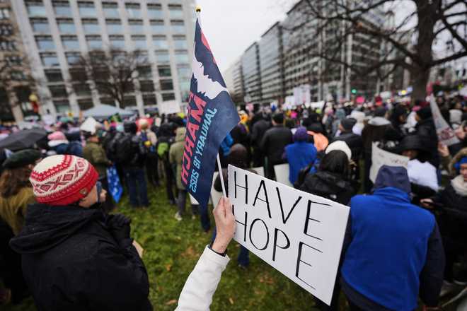 A&#x20;person&#x20;holds&#x20;a&#x20;sign&#x20;reading,&#x20;&amp;quot&#x3B;Have&#x20;Hope,&amp;quot&#x3B;&#x20;in&#x20;Farragut&#x20;Square&#x20;before&#x20;the&#x20;start&#x20;of&#x20;the&#x20;People&amp;apos&#x3B;s&#x20;March,&#x20;Saturday,&#x20;Jan.&#x20;18,&#x20;2025,&#x20;in&#x20;Washington.&#x20;&#x28;AP&#x20;Photo&#x2F;Mike&#x20;Stewart&#x29;