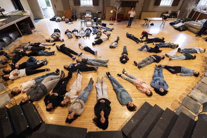 Students with the Theatre Palisades&apos; youth theatre program participate in a master class with American actress and singer Kerry Butler after their theater was destroyed by the Palisades Fire, at the Saint Monica Preparatory&apos;s auditorium in Santa Monica, Calif., Sunday, Jan. 26, 2025.(AP Photo/Etienne Laurent)