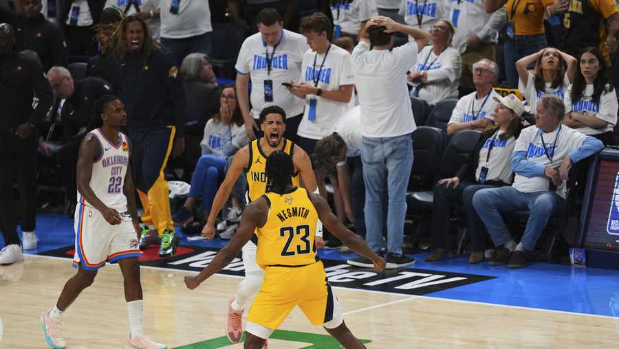 Indiana Pacers guard Tyrese Haliburton celebrates with forward Aaron Nesmith (23) after making the game-winning basket in the closing second of the second half of Game 1 of the NBA Finals basketball series against the Oklahoma City Thunder Thursday, June 5, 2025, in Oklahoma City.