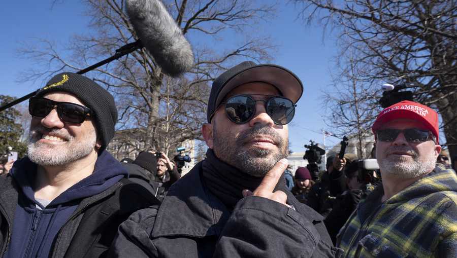 FILE - Former Proud Boys leader Enrique Tarrio is flanked by Dominic Pezzola, left, and Joseph Biggs, right, at a news conference outside the U.S. Capitol in Washington, Feb. 21, 2025.