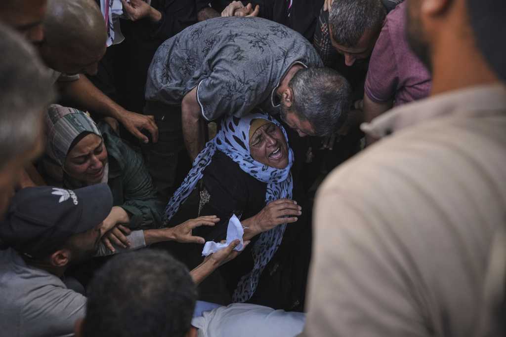 Israeli airstrikes kill 14 Palestinians in Gaza and another 10 die seeking food