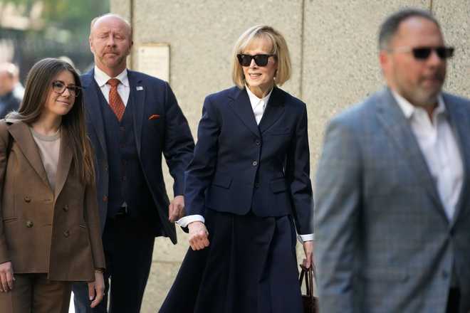 Former&#x20;advice&#x20;columnist&#x20;E.&#x20;Jean&#x20;Carroll,&#x20;second&#x20;from&#x20;right,&#x20;arrives&#x20;to&#x20;federal&#x20;court&#x20;in&#x20;New&#x20;York,&#x20;Wednesday,&#x20;April&#x20;26,&#x20;2023.&#x20;Jurors&#x20;have&#x20;been&#x20;seated&#x20;in&#x20;the&#x20;trial&#x20;over&#x20;Carroll&#x27;s&#x20;claim&#x20;that&#x20;former&#x20;President&#x20;Donald&#x20;Trump&#x20;raped&#x20;her&#x20;nearly&#x20;three&#x20;decades&#x20;ago&#x20;in&#x20;a&#x20;department&#x20;store&#x20;dressing&#x20;room.&#x20;&#x28;AP&#x20;Photo&#x2F;Seth&#x20;Wenig&#x29;