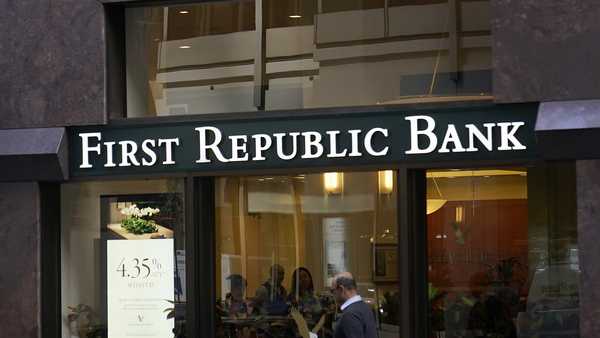 A pedestrian walks past a First Republic Bank in San Francisco on April 26, 2023. Regulators continued their search for a solution to First Republic Bank's woes over the weekend before stock markets were set to open Monday, May 1. (AP Photo/Jeff Chiu, File)