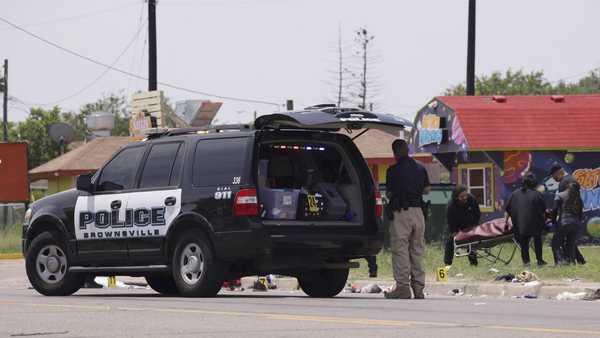 Emergency personnel respond to a fatal collision in Brownsville, Texas, on Sunday, May 7, 2023. Several migrants were killed after they were struck by a vehicle while waiting at a bus stop near Ozanam Center, a migrant and homeless shelter. (AP Photo/Michael Gonzalez)
