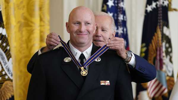 President Joe Biden presents the Medal of Valor, the nation's highest honor for bravery by a public safety officer, to Lt. Justin Hespeler, of the New York City Fire Dept., during an event in the East Room of the White House, Wednesday, May 17, 2023, in Washington.