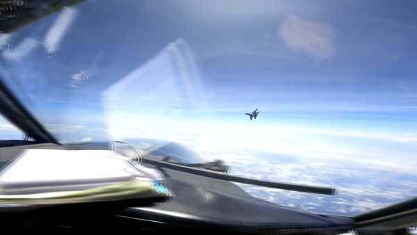 In this image from video provided by the U.S. Navy, a Chinese J-16 fighter flys aggressively close to a U.S. RC-135 aircraft flying in international airspace over the South China Sea on Friday, May 26, 2023. In a statement, U.S. Indo-Pacific Command said the Chinese J-16 fighter pilot 