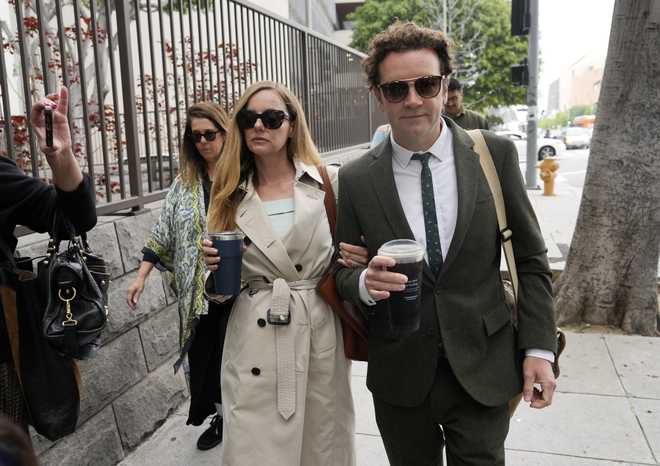 FILE&#x20;-&#x20;Danny&#x20;Masterson,&#x20;right,&#x20;and&#x20;his&#x20;wife&#x20;Bijou&#x20;Phillips&#x20;arrive&#x20;for&#x20;closing&#x20;arguments&#x20;in&#x20;his&#x20;second&#x20;trial,&#x20;May&#x20;16,&#x20;2023,&#x20;in&#x20;Los&#x20;Angeles.&#x20;A&#x20;jury&#x20;found&#x20;&#x201C;That&#x20;&#x2019;70s&#x20;Show&#x201D;&#x20;star&#x20;Masterson&#x20;guilty&#x20;of&#x20;two&#x20;counts&#x20;of&#x20;rape&#x20;Wednesday,&#x20;May&#x20;31,&#x20;in&#x20;a&#x20;Los&#x20;Angeles&#x20;retrial&#x20;in&#x20;which&#x20;the&#x20;Church&#x20;of&#x20;Scientology&#x20;played&#x20;a&#x20;central&#x20;role.&#x20;&#x28;AP&#x20;Photo&#x2F;Chris&#x20;Pizzello,&#x20;File&#x29;