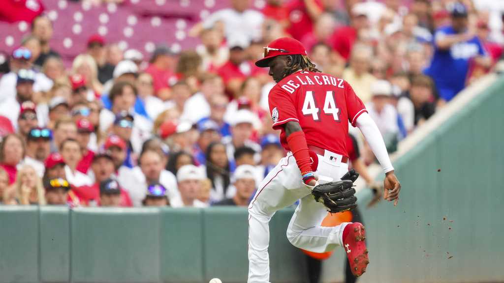 Elly de La Cruz Cincinnati Reds Unsigned Running with Mr. Redlegs Photograph