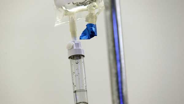 FILE - In this May 25, 2017 file photo, chemotherapy drugs are administered to a patient at a hospital in Chapel Hill, N.C. A growing shortage of common cancer treatments is forcing doctors to switch medications and delaying care, prominent U.S. cancer centers say. The National Comprehensive Cancer Network said Wednesday, June 7, 2023, that nearly all the centers it surveyed in late May 2023 were dealing with shortages of the chemotherapies carboplatin and cisplatin. (AP Photo/Gerry Broome)
