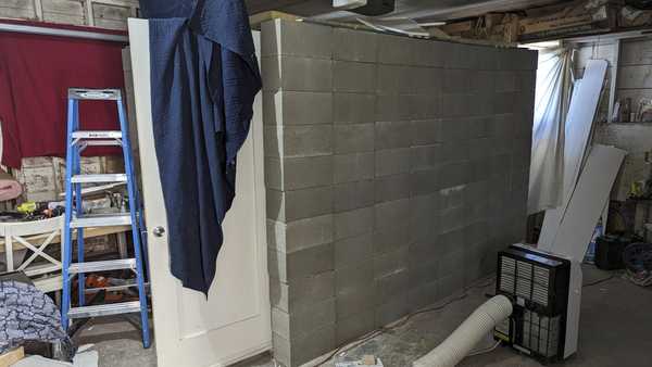 This undated photo provided by the Federal Bureau of Investigation's Portland Field Office shows a makeshift cinderblock cell in Klamath Falls, Ore. allegedly used by 29-year-old, Negasi Zuberi. Authorities say Zuberi who posed as an undercover police officer kidnapped a woman in Seattle, drove her hundreds of miles to his home in Oregon, and kept her in a makeshift cell from which she eventually escaped and found help. The FBI said Tuesday, Aug. 1, 2023, that police in Reno, Nevada, arrested Zuberi after he fled from his home in Klamath Falls, Oregon, where he had taken the Seattle woman. (FBI via AP)