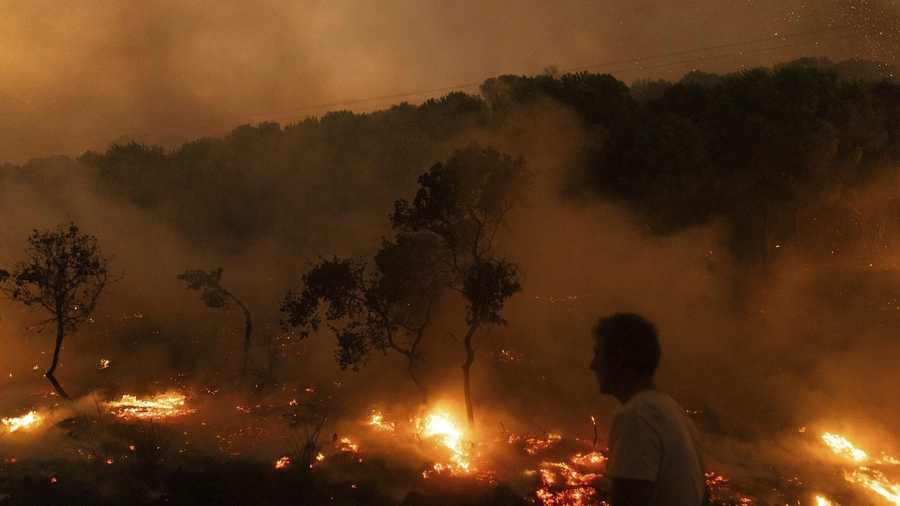 A view of flames as a forest burns, in the village of Dikela, near Alexandroupolis town, in the northeastern Evros region, Greece, Aug. 22, 2023.