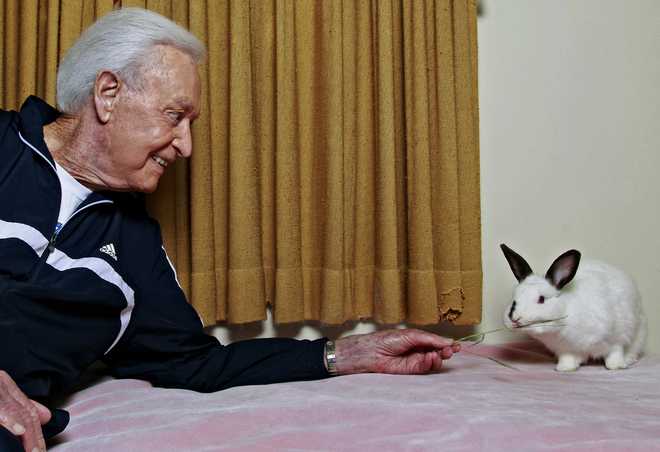 FILE&#x20;-&#x20;In&#x20;this&#x20;Tuesday,&#x20;Dec.&#x20;13,&#x20;2011&#x20;photo,&#x20;retired&#x20;game&#x20;show&#x20;host&#x20;Bob&#x20;Barker,&#x20;a&#x20;longtime&#x20;animal&#x20;rights&#x20;advocate,&#x20;holds&#x20;his&#x20;8-year-old&#x20;rabbit&#x20;Mr.&#x20;Rabbit&#x20;at&#x20;his&#x20;home&#x20;in&#x20;Los&#x20;Angeles.&#x20;&#x28;AP&#x20;Photo&#x2F;Damian&#x20;Dovarganes,&#x20;File&#x29;