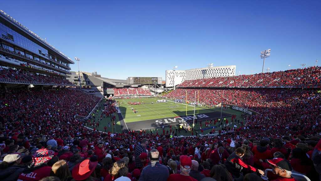 No, Cincinnati Bearcats will not play on a black football field Friday