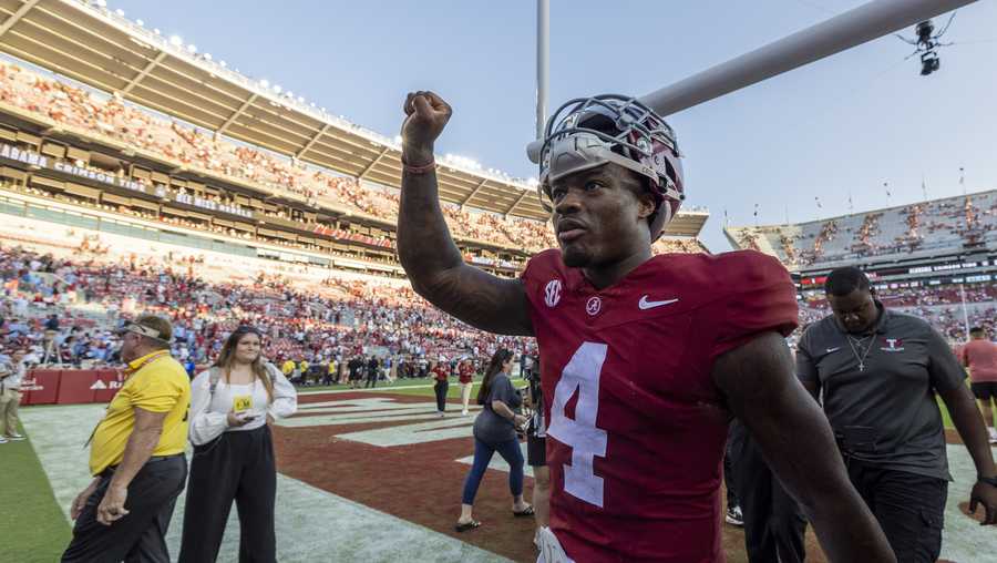 Alabama quarterback Jalen Milroe (4) lifts a fist as he celebrates a win over Mississippi after an NCAA college football game, Saturday, Sept. 23, 2023, in Tuscaloosa, Ala. (AP Photo/Vasha Hunt)