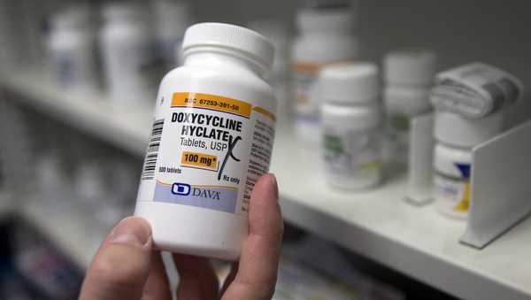 A pharmacist holds a bottle of the antibiotic doxycycline hyclate in Sacramento, Calif., July 8, 2016. U.S. health officials plan to endorse the antibiotic as a post-sex morning after pill that gay and bisexual men can use to avoid some increasingly common sexually transmitted diseases. The long-awaited guideline says doxycycline can prevent certain illnesses if taken within 72 hours of unprotected sex. One official says it's an innovative step to help battle record levels of STD infections. The Centers for Disease Control and Prevention proposal was released Monday, Oct. 2, 2023. (AP Photo/Rich Pedroncelli, File)