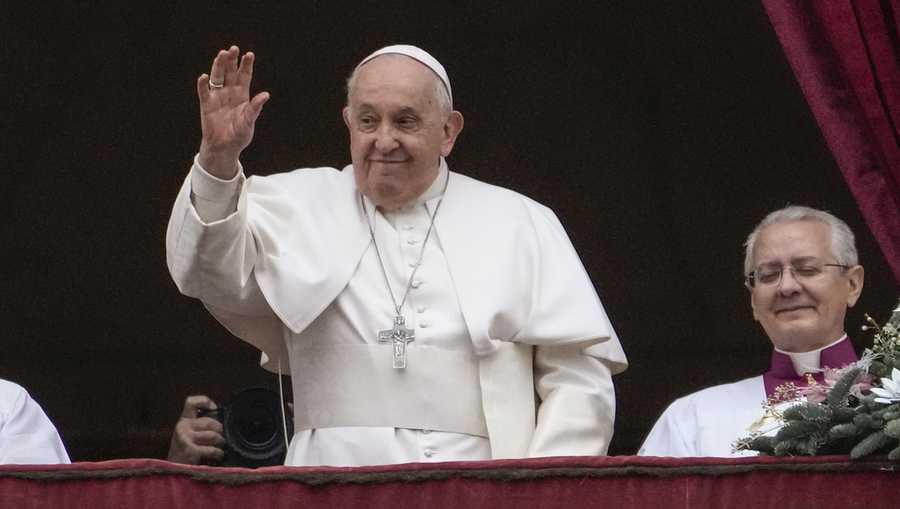 Pope Francis waves before delivering the Urbi et Orbi (Latin for &apos;to the city and to the world&apos; ) Christmas&apos; day blessing from the main balcony of St. Peter&apos;s Basilica at the Vatican, Monday Dec. 25, 2023. (AP Photo/Gregorio Borgia)