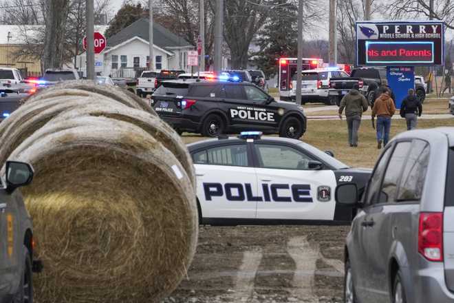 Police&#x20;respond&#x20;to&#x20;Perry&#x20;High&#x20;School&#x20;in&#x20;Perry,&#x20;Iowa.&#x20;Thursday,&#x20;Jan.&#x20;4,&#x20;2024.&#x20;Police&#x20;say&#x20;there&#x20;has&#x20;been&#x20;a&#x20;shooting&#x20;at&#x20;the&#x20;city&amp;apos&#x3B;s&#x20;high&#x20;school.&#x28;AP&#x20;Photo&#x2F;Andrew&#x20;Harnik&#x29;