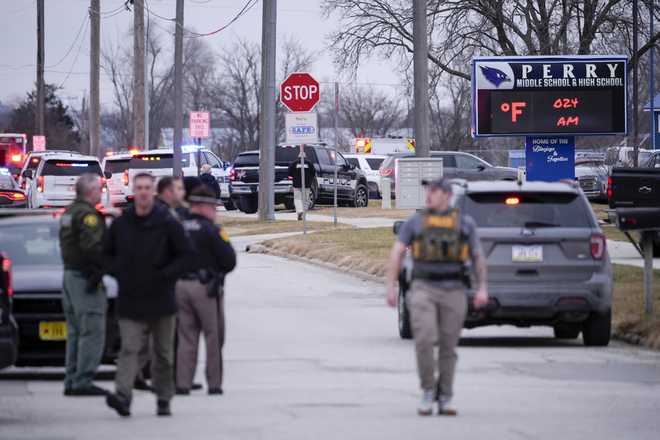 Police&#x20;respond&#x20;to&#x20;Perry&#x20;High&#x20;School&#x20;in&#x20;Perry,&#x20;Iowa.,&#x20;Thursday,&#x20;Jan.&#x20;4,&#x20;2024.&#x20;Police&#x20;say&#x20;there&#x20;has&#x20;been&#x20;a&#x20;shooting&#x20;at&#x20;the&#x20;city&amp;apos&#x3B;s&#x20;high&#x20;school.&#x28;AP&#x20;Photo&#x2F;Andrew&#x20;Harnik&#x29;
