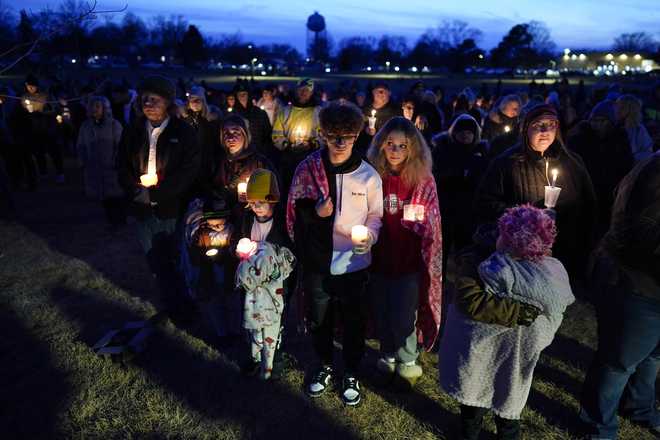Local&#x20;residents&#x20;pray&#x20;during&#x20;a&#x20;candlelight&#x20;vigil&#x20;following&#x20;a&#x20;shooting&#x20;at&#x20;Perry&#x20;High&#x20;School,&#x20;Thursday,&#x20;Jan.&#x20;4,&#x20;2024,&#x20;in&#x20;Perry,&#x20;Iowa.&#x20;&#x28;AP&#x20;Photo&#x2F;Charlie&#x20;Neibergall&#x29;