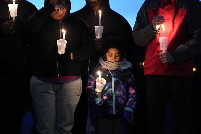 Local&#x20;residents&#x20;pray&#x20;during&#x20;a&#x20;candlelight&#x20;vigil&#x20;following&#x20;a&#x20;shooting&#x20;at&#x20;Perry&#x20;High&#x20;School,&#x20;Thursday,&#x20;Jan.&#x20;4,&#x20;2024,&#x20;in&#x20;Perry,&#x20;Iowa.&#x20;&#x28;AP&#x20;Photo&#x2F;Charlie&#x20;Neibergall&#x29;