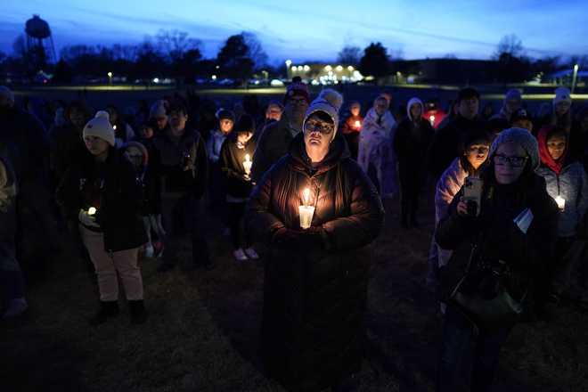 Local&#x20;residents&#x20;pray&#x20;during&#x20;a&#x20;candlelight&#x20;vigil&#x20;following&#x20;a&#x20;shooting&#x20;at&#x20;Perry&#x20;High&#x20;School,&#x20;Thursday,&#x20;Jan.&#x20;4,&#x20;2024,&#x20;in&#x20;Perry,&#x20;Iowa.&#x20;&#x28;AP&#x20;Photo&#x2F;Charlie&#x20;Neibergall&#x29;