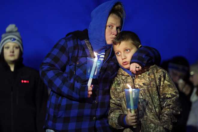 Local&#x20;residents&#x20;pray&#x20;during&#x20;a&#x20;candlelight&#x20;vigil&#x20;following&#x20;a&#x20;shooting&#x20;at&#x20;Perry&#x20;High&#x20;School,&#x20;Thursday,&#x20;Jan.&#x20;4,&#x20;2024,&#x20;in&#x20;Perry,&#x20;Iowa.&#x20;&#x28;AP&#x20;Photo&#x2F;Charlie&#x20;Neibergall&#x29;
