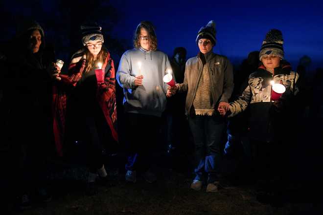 Local&#x20;residents&#x20;pray&#x20;during&#x20;a&#x20;candlelight&#x20;vigil&#x20;following&#x20;a&#x20;shooting&#x20;at&#x20;Perry&#x20;High&#x20;School,&#x20;Thursday,&#x20;Jan.&#x20;4,&#x20;2024,&#x20;in&#x20;Perry,&#x20;Iowa.&#x20;&#x28;AP&#x20;Photo&#x2F;Charlie&#x20;Neibergall&#x29;