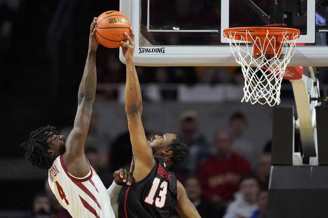 Houston&#x20;forward&#x20;J&amp;apos&#x3B;Wan&#x20;Roberts&#x20;&#x28;13&#x29;&#x20;blocks&#x20;a&#x20;shot&#x20;by&#x20;Iowa&#x20;State&#x20;guard&#x20;Demarion&#x20;Watson&#x20;&#x28;4&#x29;&#x20;during&#x20;the&#x20;first&#x20;half&#x20;of&#x20;an&#x20;NCAA&#x20;college&#x20;basketball&#x20;game,&#x20;Tuesday,&#x20;Jan.&#x20;9,&#x20;2024,&#x20;in&#x20;Ames,&#x20;Iowa.&#x20;&#x28;AP&#x20;Photo&#x2F;Charlie&#x20;Neibergall&#x29;