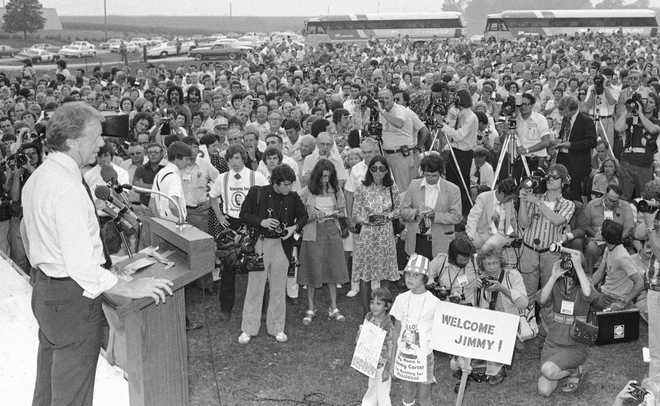 FILE&#x20;-&#x20;Jimmy&#x20;Carter,&#x20;Democratic&#x20;presidential&#x20;candidate,&#x20;left,&#x20;speaks&#x20;to&#x20;a&#x20;crowd&#x20;of&#x20;supporters&#x20;on&#x20;the&#x20;Van&#x20;Ryswyk&#x20;farm&#x20;in&#x20;Des&#x20;Moines,&#x20;Iowa,&#x20;Aug.&#x20;24,&#x20;1976.&#x20;The&#x20;once-every-four-years&#x20;Iowa&#x20;caucuses&#x20;grew&#x20;to&#x20;be&#x20;an&#x20;entrenched&#x20;part&#x20;of&#x20;U.S.&#x20;politics,&#x20;catapulting&#x20;little-known&#x20;one-time&#x20;peanut&#x20;farmer&#x20;Carter&amp;apos&#x3B;s&#x20;bid&#x20;for&#x20;the&#x20;White&#x20;House.&#x20;&#x28;AP&#x20;Photo,&#x20;File&#x29;