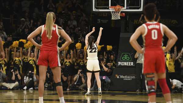 Iowa guard Caitlin Clark (22) sinks a technical foul to become the all-time leading scorer in NCAA Division I basketball during the first half of a college game against Ohio State, Sunday, March 3, 2024, in Iowa City, Iowa. (AP Photo/Cliff Jette)