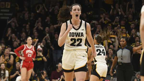 Iowa guard Caitlin Clark (22) celebrates after becoming the all-time leading scorer in NCAA Division I basketball during the first half of a college game against Ohio State, Sunday, March 3, 2024, in Iowa City, Iowa. (AP Photo/Cliff Jette)