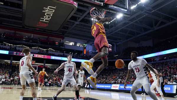 Iowa State forward Hason Ward (24) dunks against Cincinnati's Simas Lukosius (41) during an NCAA college basketball game, Tuesday, Feb. 13, 2024, in Cincinnati. (AP Photo/Jeff Dean)