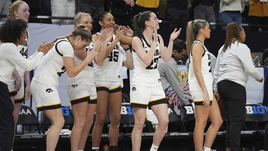 Iowa guard Caitlin Clark, center, celebrates with teammates as time expires in the team&apos;s win over Michigan following an NCAA college basketball game in the semifinals of the Big Ten women&apos;s tournament Saturday, March 9, 2024, in Minneapolis. (AP Photo/Abbie Parr)