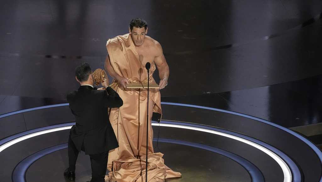 In a bit, John Cena appears in the buff on the Academy Awards stage