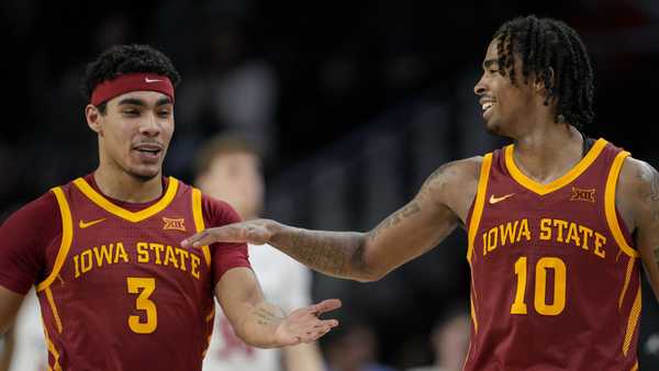 Iowa State's Tamin Lipsey (3) celebrates with Keshon Gilbert (10) following an NCAA college basketball game against Cincinnati, Tuesday, Feb. 13, 2024, in Cincinnati. (AP Photo/Jeff Dean)