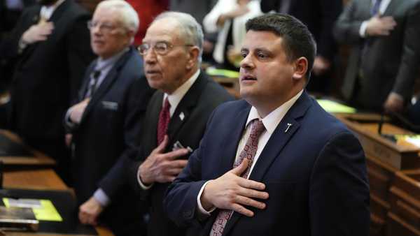 Iowa House Speaker Pat Grassley, right, stands with his grandfather U.S. Sen. Chuck Grassley, R-Iowa, during the Pledge of Allegiance on the opening day of the Iowa Legislature, Monday, Jan. 9, 2023, in Des Moines, Iowa. (AP Photo/Charlie Neibergall)