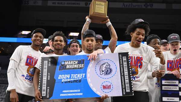 Members of Drake hold a sign signifying that they are going to the March Madness tournament after beating Indiana State after the championship game in the Missouri Valley Conference NCAA basketball tournament, Sunday, March 10, 2024, in St. Louis. (AP Photo/Joe Puetz)