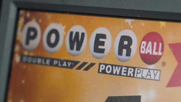 FILE - A display panel advertises tickets for a Powerball drawing at a convenience store, Nov. 7, 2022, in Renfrew, Pa. There is an $865 million Powerball jackpot up for grabs Wednesday night, March 27, 2024. (AP Photo/Keith Srakocic, File)